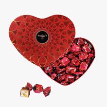Red heart box of chocolates with soft nougat, almond and honey centres. Maxim’s de Paris