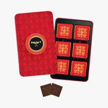 Boîte de 12 carrés de chocolat au lait Maxim’s de Paris